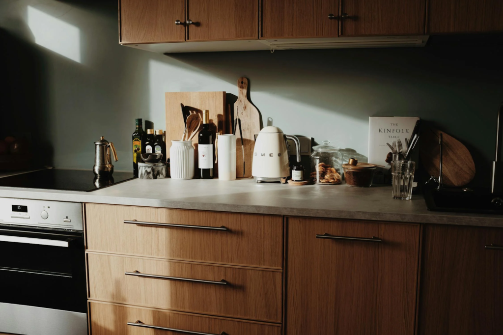 concrete kitchen countertop with many kitchen tools and cutting boards