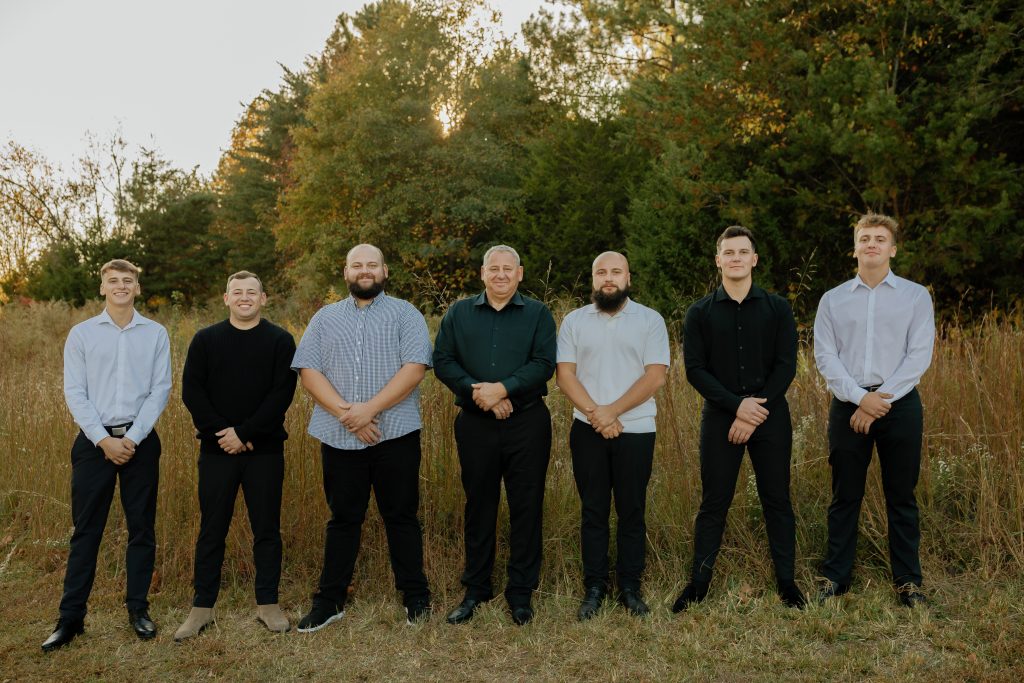 kamanski construction team photo during sunset