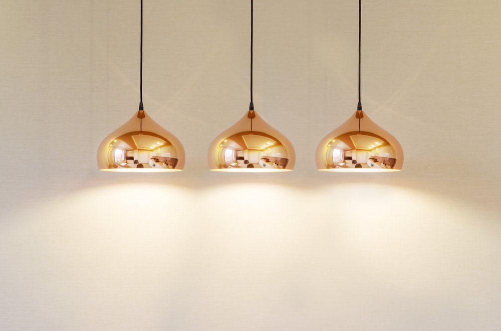 gold lights hanging from the ceiling