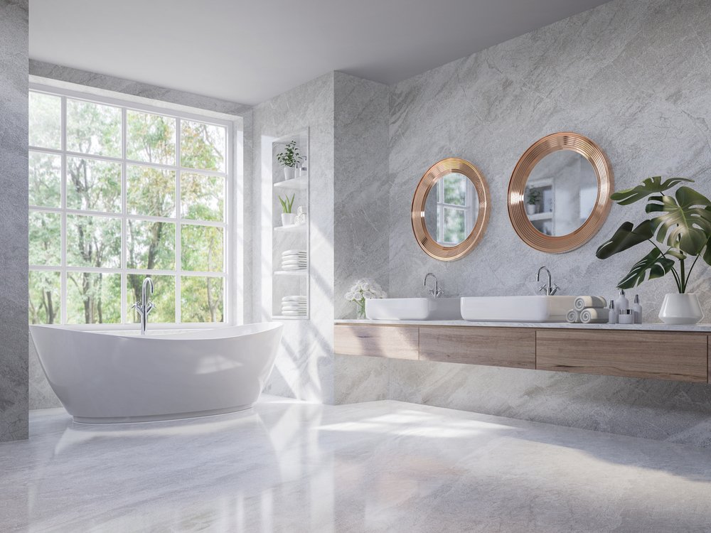 A large primary bathroom with soaking tub and plenty of natural light.