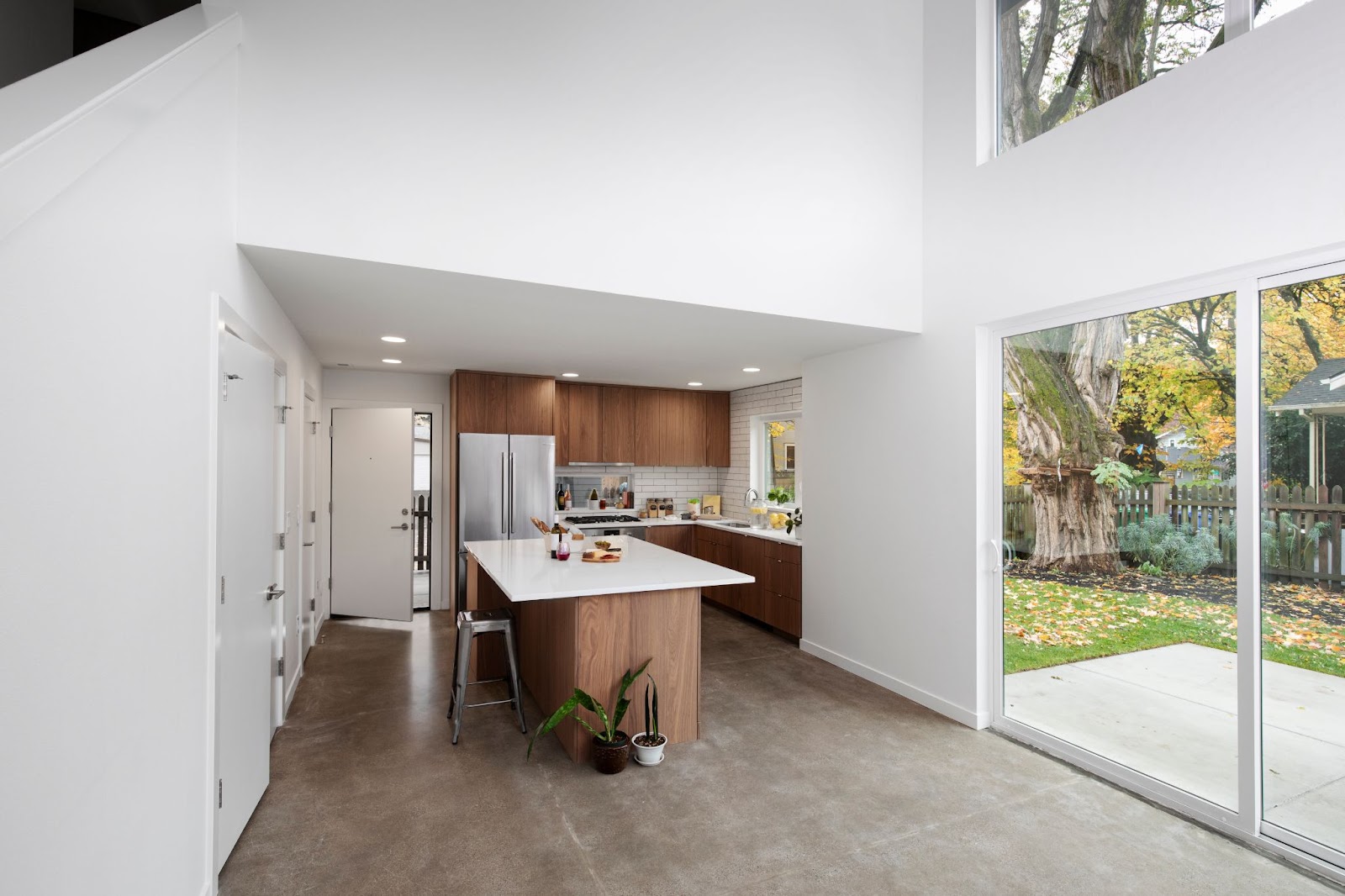 an accessory dwelling unit with large windows and white walls