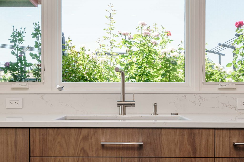 kitchen sink with stainless steel faucet