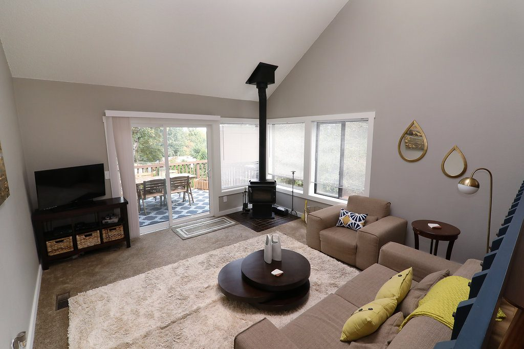 living room with grey walls and beige furniture